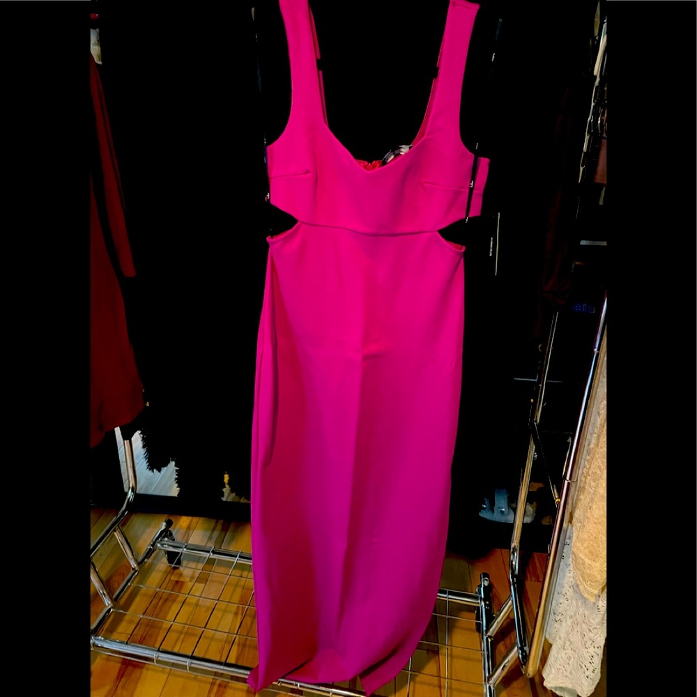 Pink maxi dress with side cut outs.